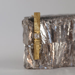 Sculptural gold jewellery, solitaire 18ct gold stud earring with princess cut diamond and hand-carved texture