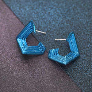 18ct white gold stud earrings with handmade textured layers and blue nano-ceramic coating