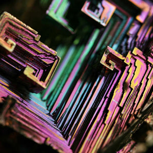 Pink, green and yellow details of bismuth crystal, inspiration for jewellery design