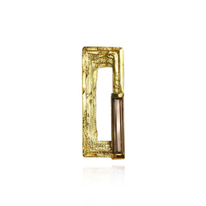 Cavetto 18kt gold statement lapel pin with smoky quartz faceted baguette and hand-textured layers.