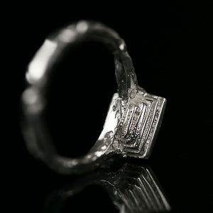 18ct white gold ring with princess cut diamond and handmade texture inspired by ancient architecture