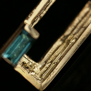 18ct gold lapel pin with handmade textured layers and blue tourmaline baguette