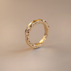 Hand-forged 18ct gold ring with raw molten texture inspired by eroded antique buildings, textured gold ring for men