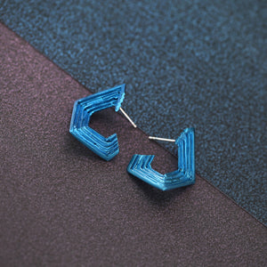 18ct white gold stud earrings with handmade textured layers and blue nano-ceramic coating, made to order