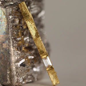 Modernist, sculptural XYZ Parallax brooch in 18k gold and baguette cut diamond