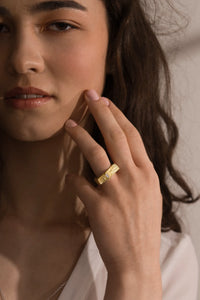 The XYZ Tectum geometric 18k gold ring with diamond baguette