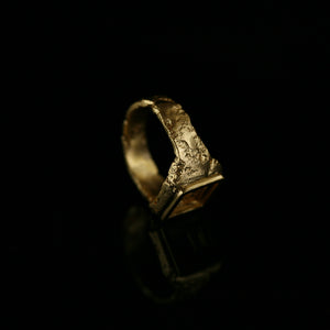 Cavetto Signet Ring in sculpted 18kt yellow gold and rich texture, side view.