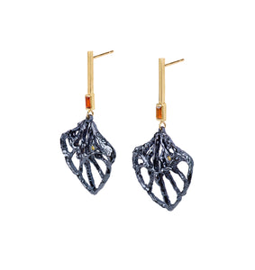 Iris Laevigata statement drop earrings in 18kt yellow gold, blue rhodium plated silver, with yellow diamonds and orange citrines, angled view.