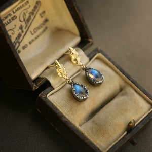 Lava Iridesce rainbow moonstone, 18kt raw gold and oxidised silver statement drop earrings, presented in a vintage box.