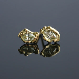 Details of Lava Naples yellow diamond marquise 18kt gold stud earrings with sculpted volcanic texture. Part of the Lava Series.