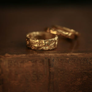 Liquid Aurum Alto matching set of two 18kt yellow gold statement rings with hand-forged rusticated texture.