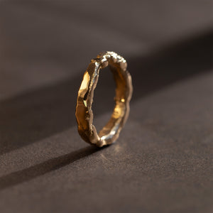 Liquid Aurum Stamenment 18kt yellow gold ring with raw texture sculpted with fire. Part of the Cyclopean collection.
