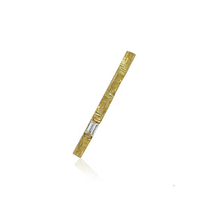 XYZ Parallax 18kt yellow gold modernist statement brooch with 0.3ct baguette diamond.