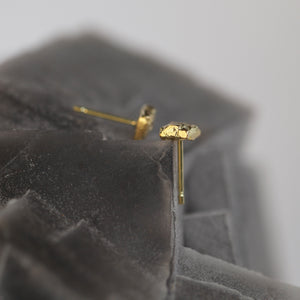 Tessara unisex statement stud earrings in solid 18kt yellow gold, side view.